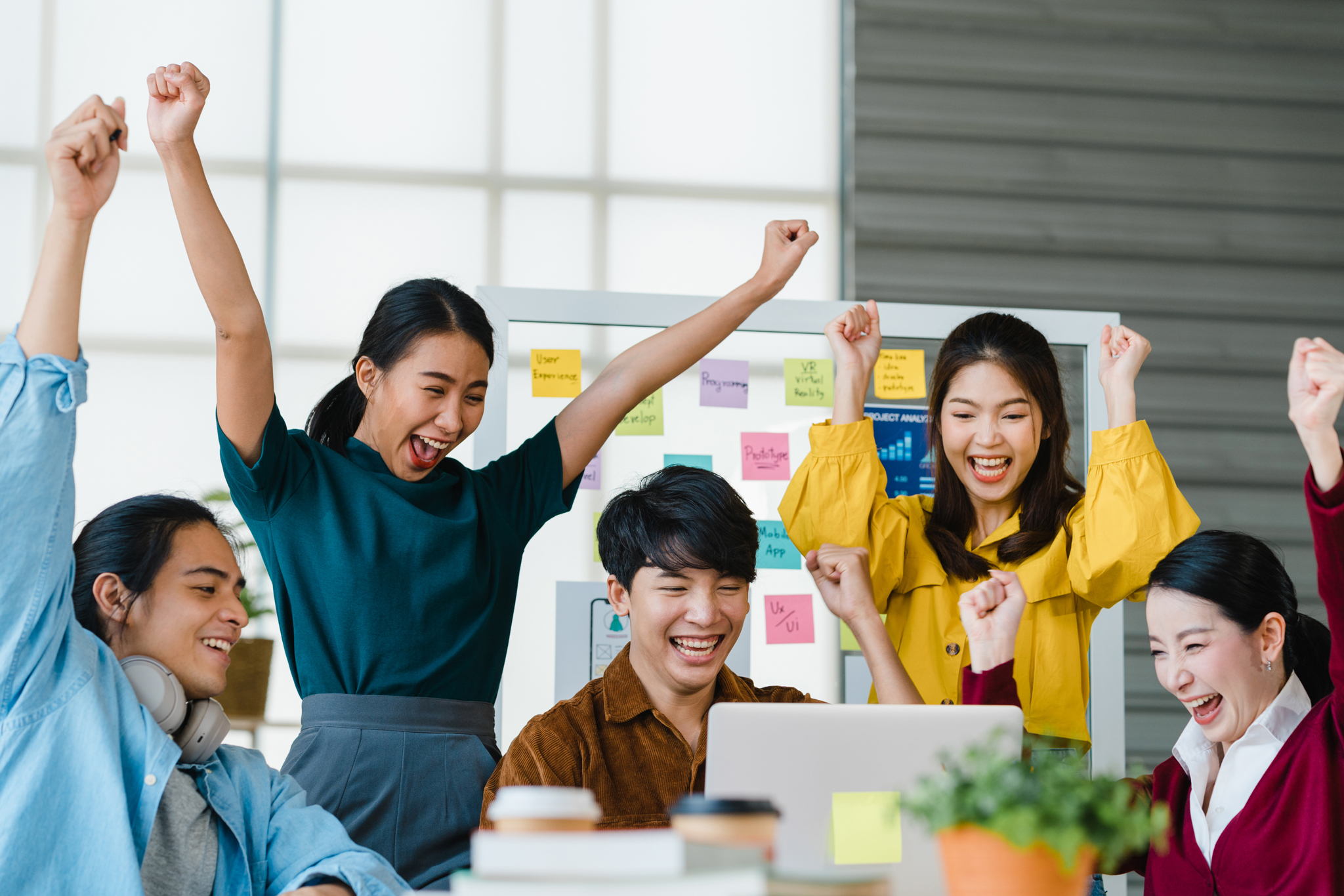 Group of young professionals celebrating success
